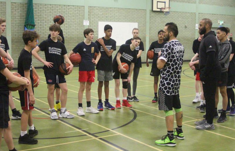 Legendary NBA Trainer Irving Roland Helps Young Blackhawks Fly